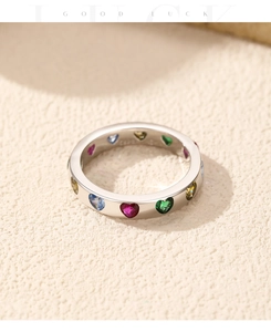 Macro shot of S925 silver ring featuring multi-colored heart-shaped zircon stones