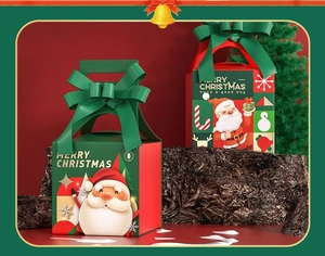 Detail of Christmas gift boxes with Santa illustrations and MERRY CHRISTMAS ribbons