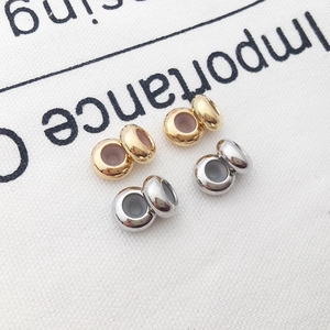Vier goldene und silberne Stopper-Perlen aus Kupfer mit Silikon-Inlay für Armbänder