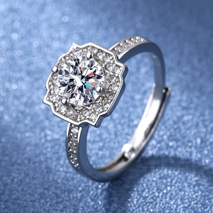 Detailed macro shot of a sparkling one carat high carbon diamond ring with halo setting
