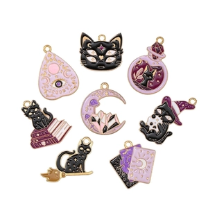 Set of 8 enamel witchy charms featuring black cats, tarot cards, and mystical moon icons