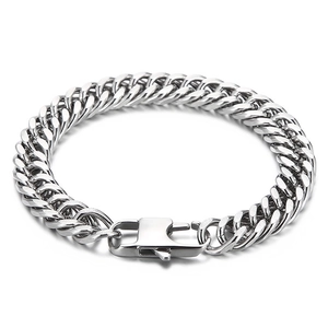 Minimalist silver cuban chain bracelet with a unique buckle clasp on a white background