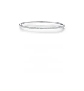 Macro detail of silver S925 bangle featuring micro-pave cubic zirconia stones