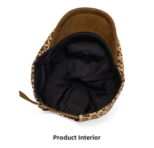 Internal view of leopard print newsboy cap showing black lining and adjustable strap