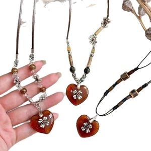 Handcrafted heart pendant necklace with crystal beads and bohemian cross accents