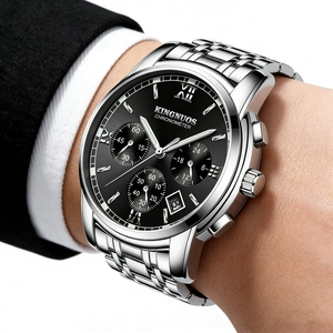 Macro view of silver stainless steel men's watch with black dial and luminous hands