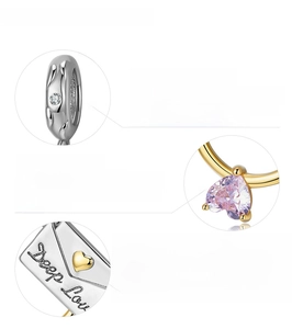 Detailed macro views of gold-plated 925 silver envelope charm with Deep Love engraving