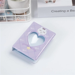 Detail of purple 3-inch mini photo album with cat pattern and heart-shaped hollow cover