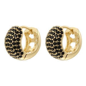 Detail of gold huggie earrings with black pave-set zircons and heart hollow pattern