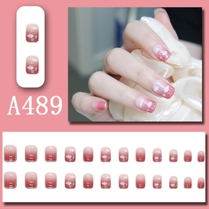 Short pink gradient press-on nails with white clouds and silver glitter accents