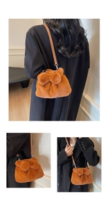Brown plush bucket bag with leather strap and decorative pompom shown from three views