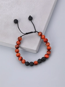 Braided men's bracelet with 8mm tiger eye and lava stone beads on a grey stone base
