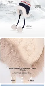 Detail of Fair Isle knit winter hat with white plush trim and fuzzy pom-poms on 30cm cords