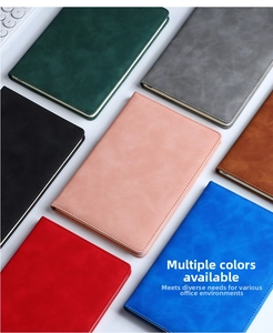 Flat lay of colorful A5 business notebooks with stitched PU leather covers in seven colors
