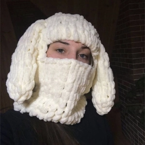 Close-up of white chunky knit balaclava with long rabbit ears decoration