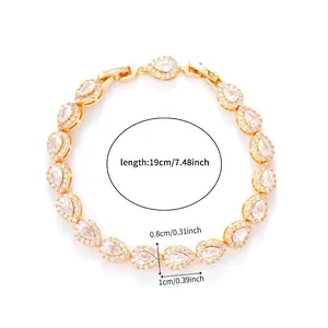 Close-up of gold-plated bracelet with pear-cut cubic zirconia and micro-pave setting