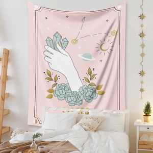 Detail of Pisces zodiac tapestry featuring pink bohemian crystals and celestial motifs