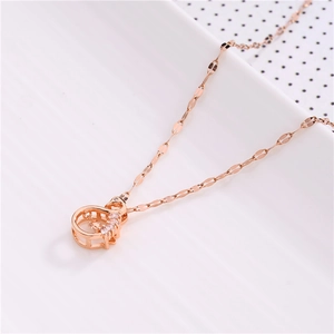 Detail view of a rose gold swan pendant necklace featuring sparkling cubic zirconia stones