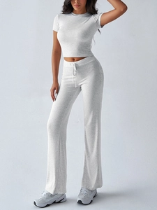Detail view of women's grey two-piece lounge set with short sleeve top and drawstring pants