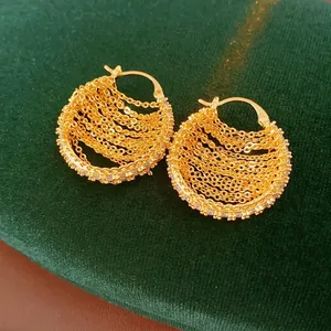 Gold plated geometric hoop earrings with zircon chain fringe on velvet display