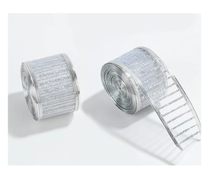 Close-up of silver glitter striped mesh ribbon rolls for Christmas tree decorations
