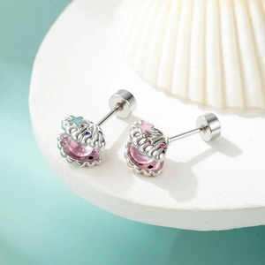 Pink shell and starfish stud earrings set with colorful gemstones on a white display