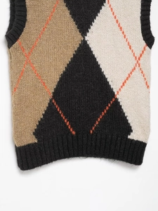 Detail showing the argyle knit pattern and ribbed hem on this V-neck college style sweater vest