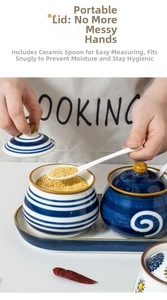 Detail view of hand-painted ceramic seasoning jar with lid and spoon on tray