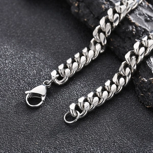 Macro shot of silver stainless steel Cuban chain link with secure lobster clasp