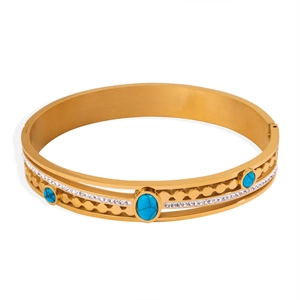Vintage gold-plated steel cuff bracelet with turquoise stones and CZ diamonds in hollow design