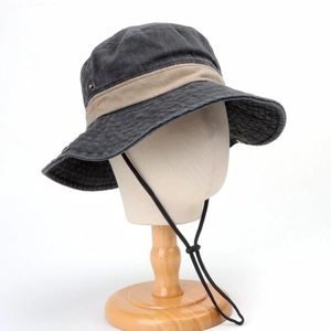 Detail view of washed cotton boonie hat with adjustable chin strap and breathable eyelets