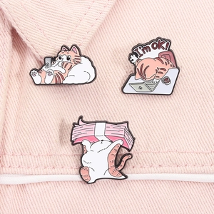 Three creative cartoon cat enamel pins on pink fabric showing diverse work-life poses