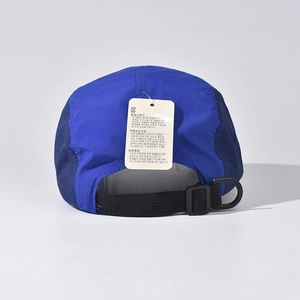 Detail of five-panel baseball cap with adjustable strap and D-ring buckle closure
