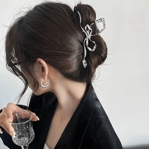 Y2K silver metal butterfly hair claw clip for thick hair shown on model from side view