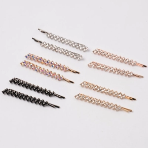 Detail shot of five color options for rhinestone hair pins in silver, gold and rose gold