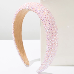 Pink sponge headband with sparkling star rhinestones on a white minimalist display