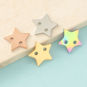 Macro view of four-color stainless steel star charms with double holes for jewelry making