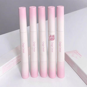 Detail of matte finish lip creams with a gradient pink casing and sponge applicator tip