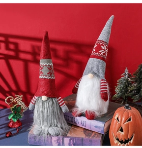 Detail of Christmas gnomes with snowflake knitting on vintage books with red background