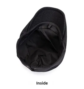 Detailed interior of the black newsboy hat featuring breathable cotton lining and sweatband