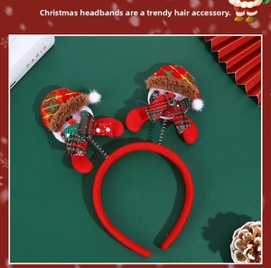 Detailed view of Christmas headband with red fabric band and two spring-mounted snowmen