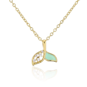 Detail view of 18K gold fish tail pendant with mint green enamel and zircon stones