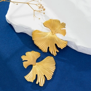 Golden ginkgo leaf stud earrings with 18K gold plating on textured stainless steel