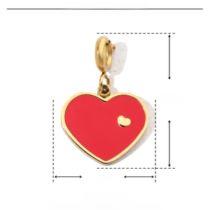 Macro view of 18mm red heart charm made of gold-plated stainless steel and enamel