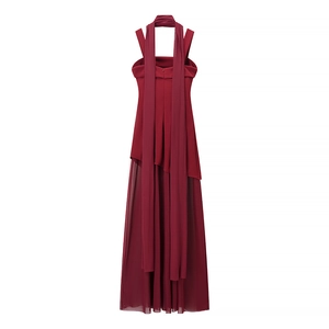 Detail of burgundy backless maxi dress featuring mesh splicing and long streamers