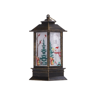 Détail d'une lanterne de Noël bronze vintage avec motifs colorés de bonhomme de neige