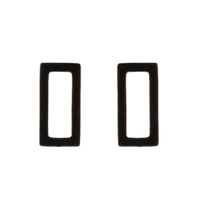 Detail view of matte black rectangular hollow stud earrings made of stainless steel