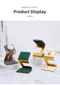 Detail of Z-shaped metal jewelry display stands with velvet liners for rings and watches