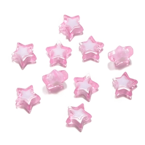 Detail of pink acrylic star beads with a white core for DIY jewelry and phone charms