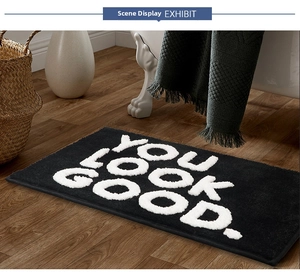 Detailed view of YOU LOOK GOOD jacquard bath mat with thick absorbent flocking texture